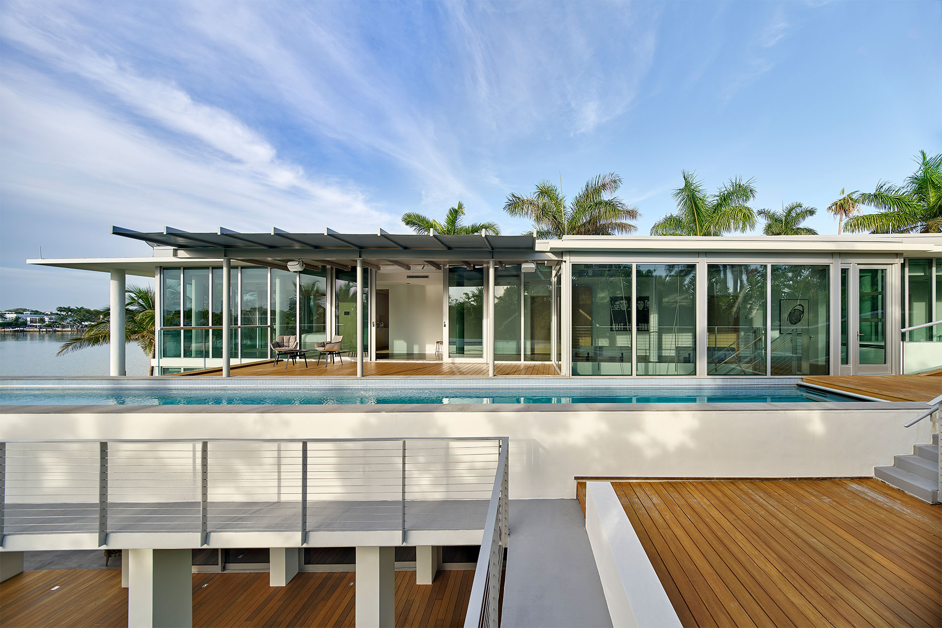 Outdoor deck overlooking the water in Florida by Woolems Luxury Builders